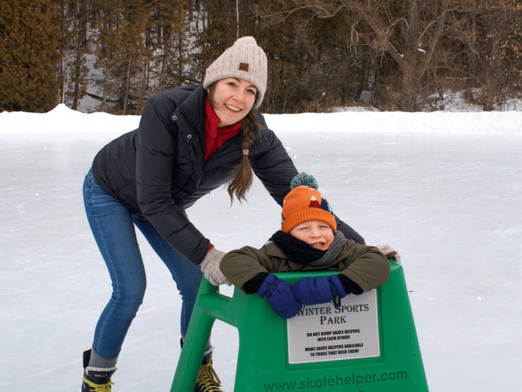Mom and small boy ice skating- family friendly outdoor activities in Petoskey michigan