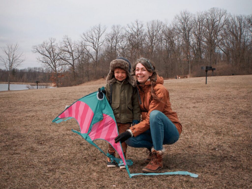 small boy and mom pose while holding kite- summer bucket list