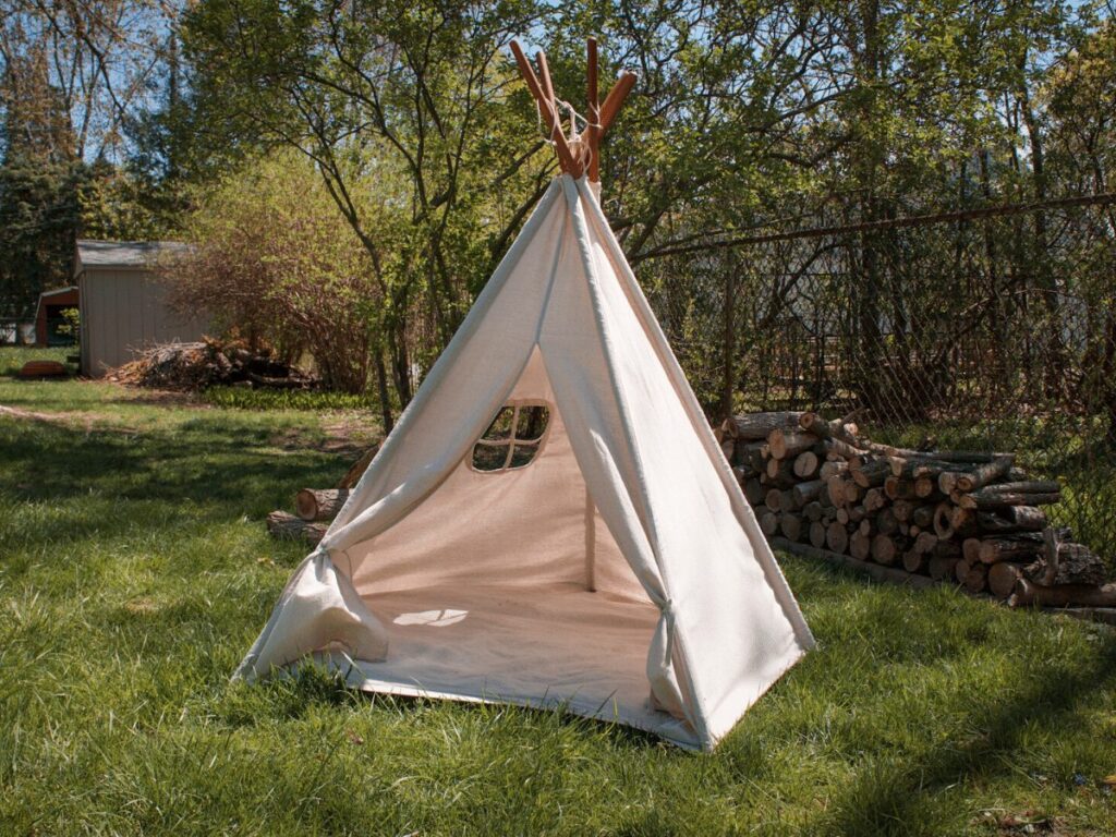 canvas teepee outside in backyad- best outdoor toys