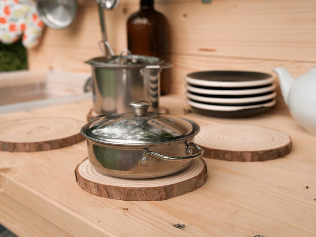 close up of pot on mud kitchen play burners