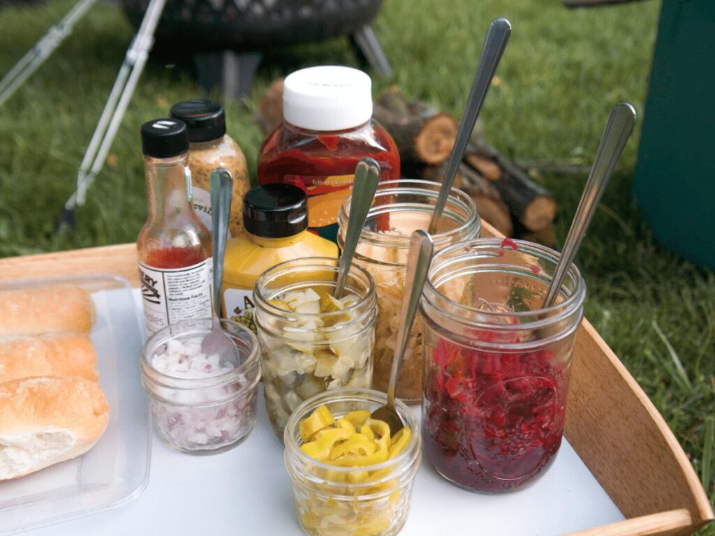 Array of condiments set out for campfire