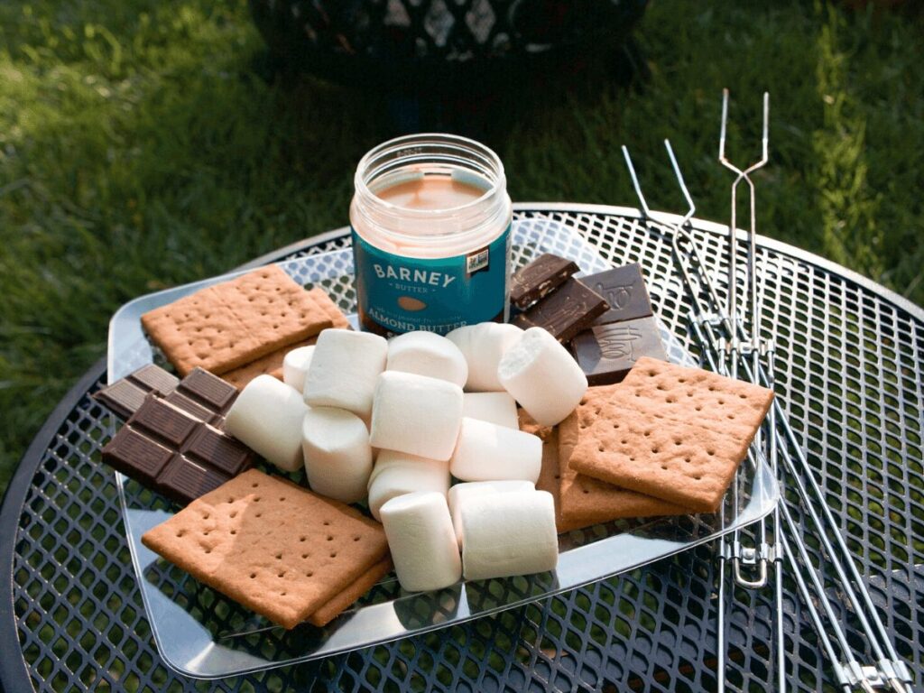 Platter of marshmallows, graham crackers, chocolate bars set out for campfire