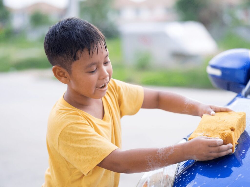 boy washes car- business ideas for kids