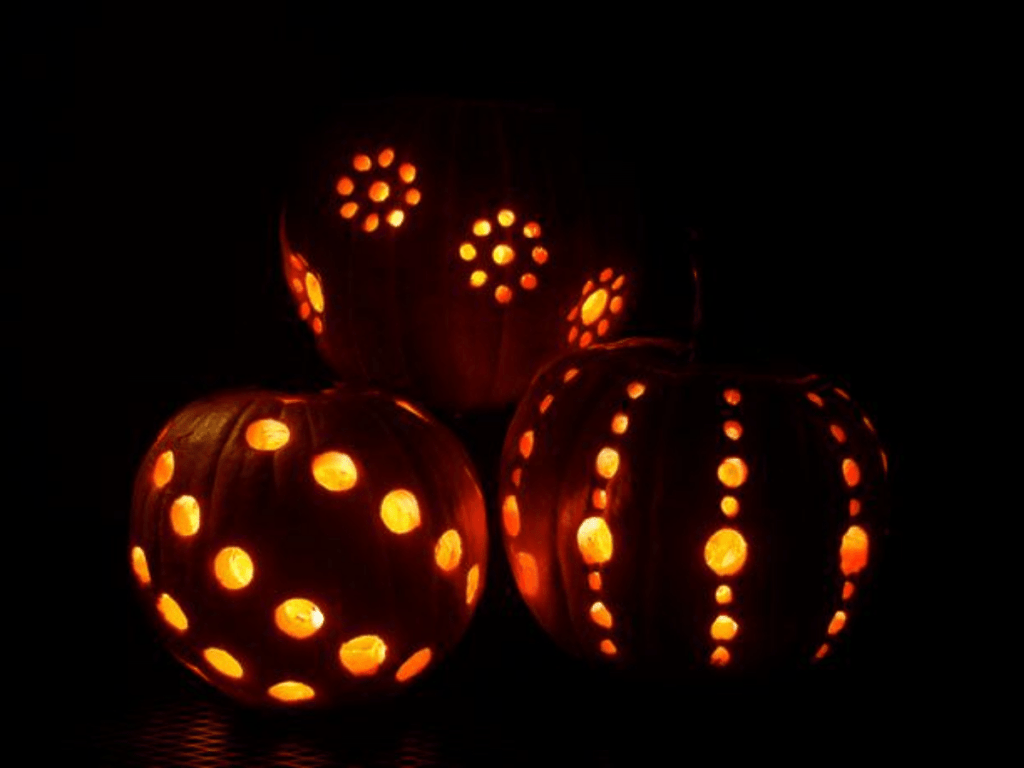 Pumpkins in the dark with holes drilled in them- pumpkin decorating ideas