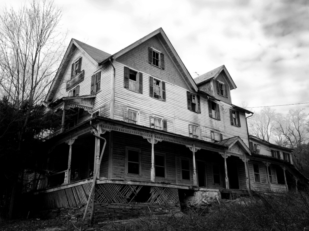 outdoor halloween activities, black and white picture of large dilapidated house