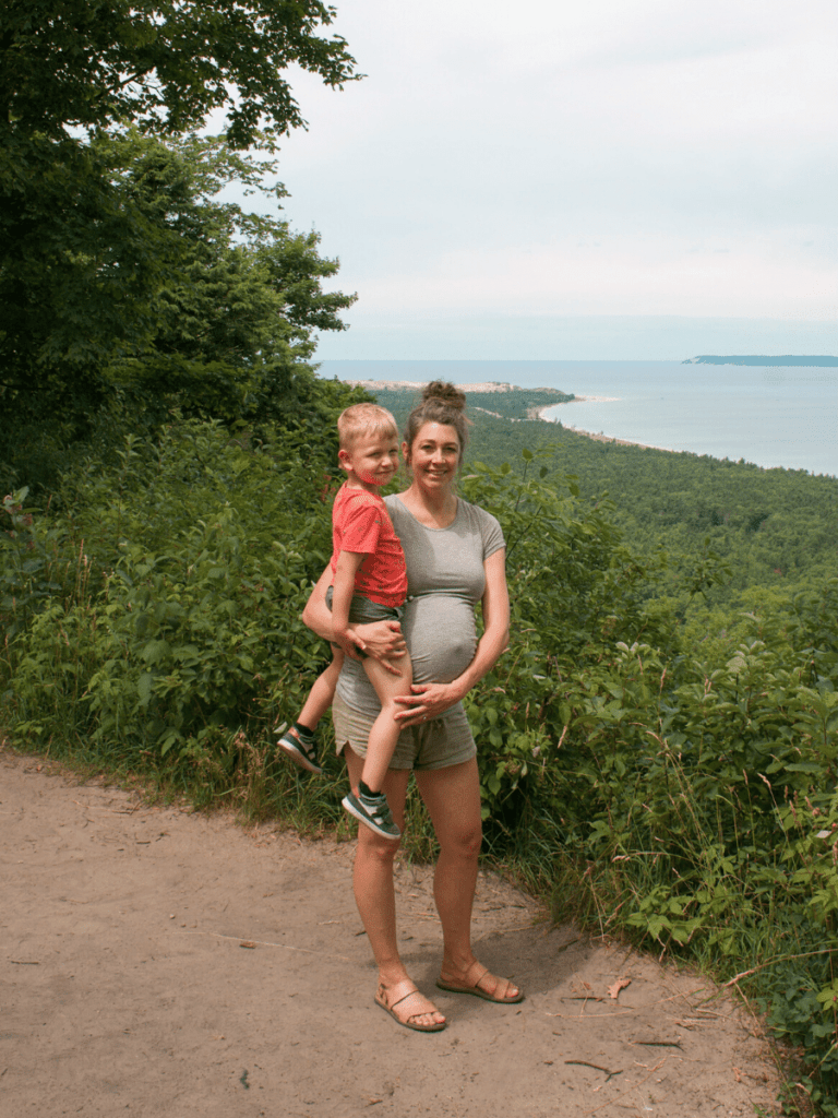 mom holds small boy on top of overlook- activities in traverse city
