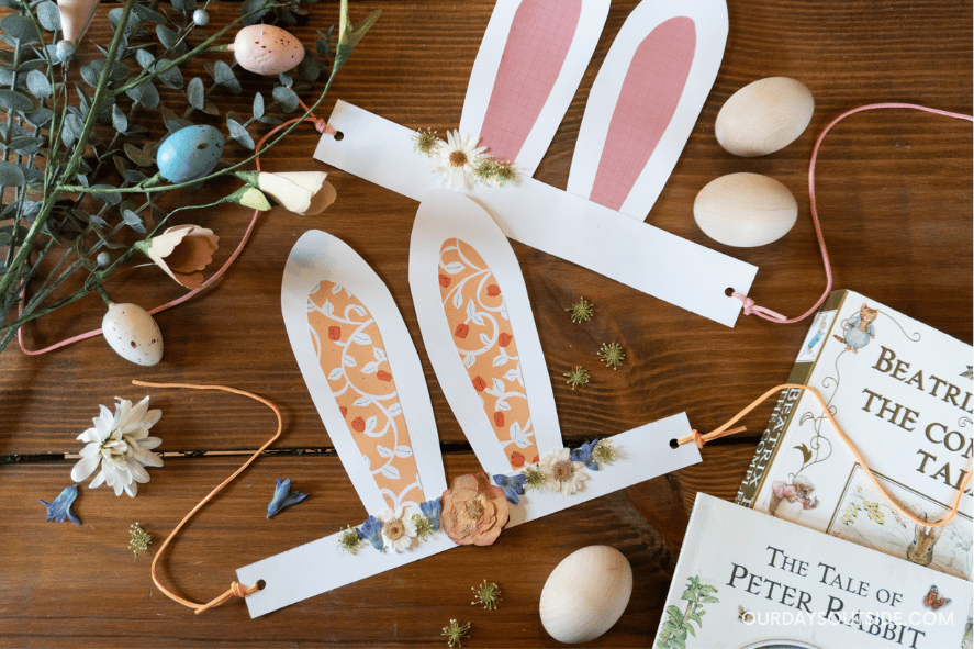 bunny ears craft - paper bunny ears headband laid out on table flatlay