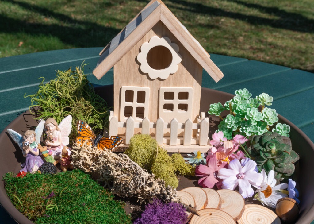 container fairy garden supplies on table
